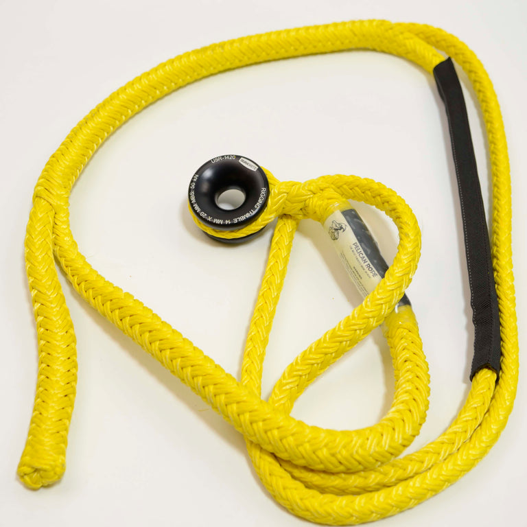 Yellow rope with a black and white tag on a white background