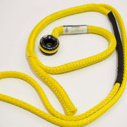 Yellow dog leash with black connector on a white background