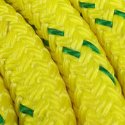 Close-up of durable yellow double-braided arborist rope with green tracer.