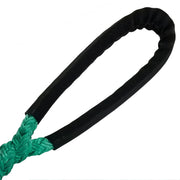 Heavy-duty green synthetic dead eye tree sling with black chafe guard, designed for arborist rigging, tree removal, and limb lowering applications.